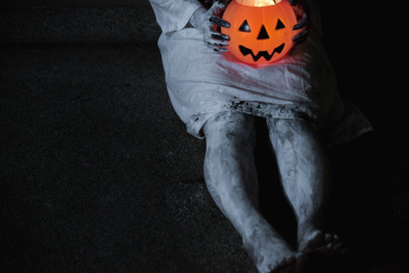 Woman ghost horror have hand holding her pumpkin, halloween concept