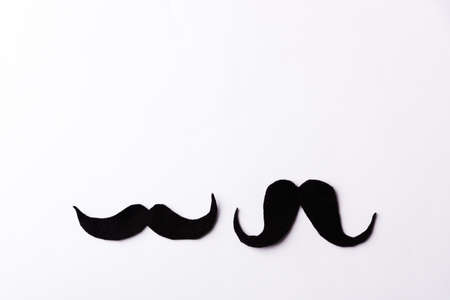 Black mustache, studio shot isolated on white background, Prostate cancer awareness month, Fathers day, minimal November moustache conceptの写真素材