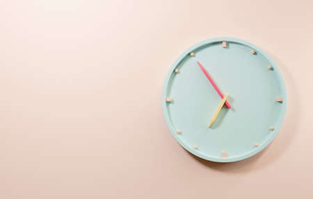 Office clock icon. Round business blue watches with time arrows hour and minutes, clock face on pink...