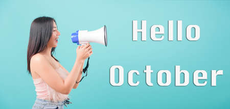 Hello October, Asian happy portrait beautiful young woman standing smile her holding her Shouting...
