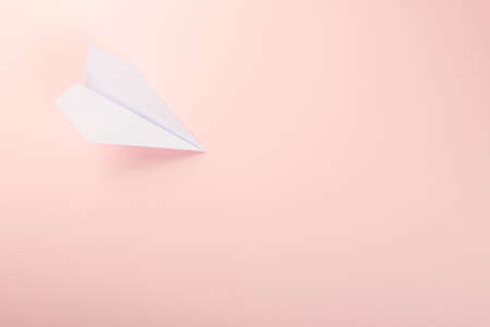 Paper plane letter document message. Top view mock up design of airplane travel, isolated on pink...