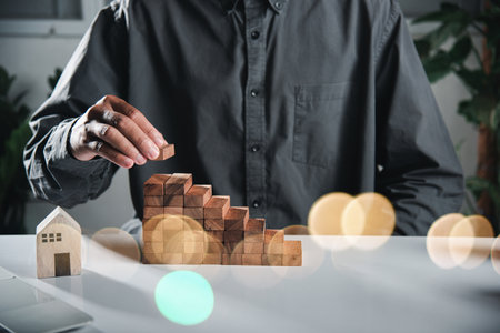Business hand arranging put wooden block stacking step stair growth success process, financial risk...
