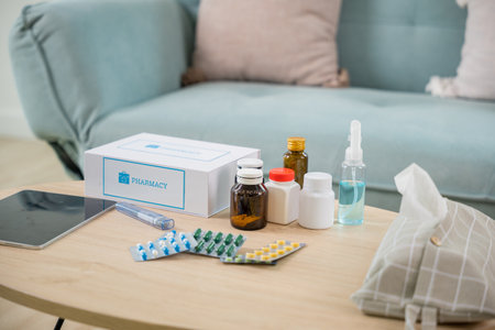 Home medicine with medicine package box free first aid kit with pills from pharmacy hospital delivery service at home on table in living room,  online purchase delivery of medicines to your homeの写真素材