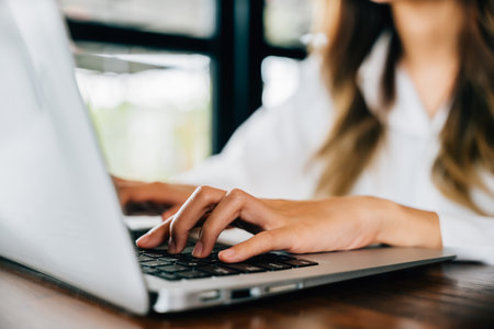 Happy beautiful freelancer blogger typing keyboard on laptop for writing blog web page, working...