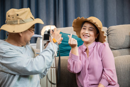 Travel and tourism. Asian couple old senior marry retired couple smiling taking photo by camera...