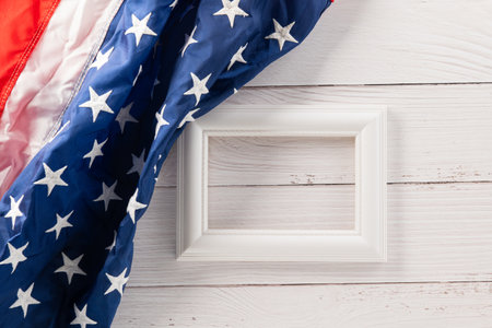 Above flag of United States American with photo frame, USA flag for Memorial day on abstract wooden background, Banner template design of presidents day concept, holiday backgroundの写真素材