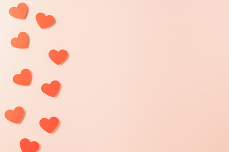 Beautiful red paper hearts shape cutting pastel pink background, Happy mother day, Symbol of love...