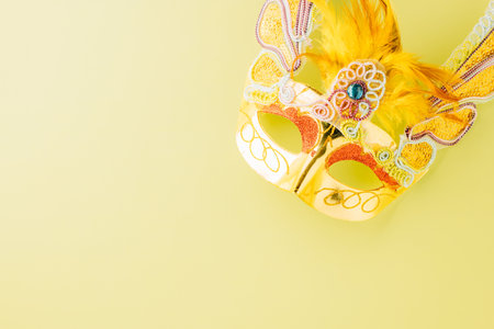 Happy Purim carnival accessories. Top view carnival mask for Mardi Gras celebration isolated on pastel green background, jewish holiday, Purim in Hebrew holidayの写真素材