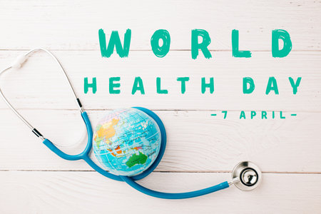 World Health Day. Top view doctor stethoscope wrapped around world globe isolated on wooden background with copy space for text, Save world day, Health care and medical conceptの写真素材