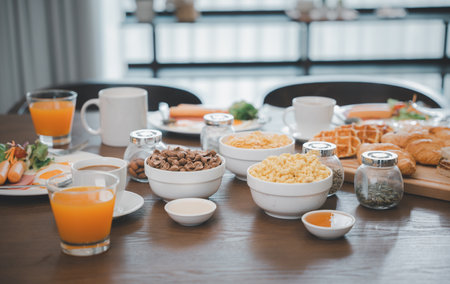 Breakfast served food with beverage coffee, orange juice on table in the morning at home, Fresh and bright continental breakfast healthyの写真素材