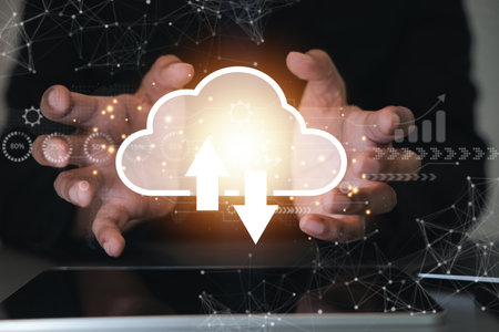 Cloud computing and networking technology concept. A man displays a digital screen with a cloud...