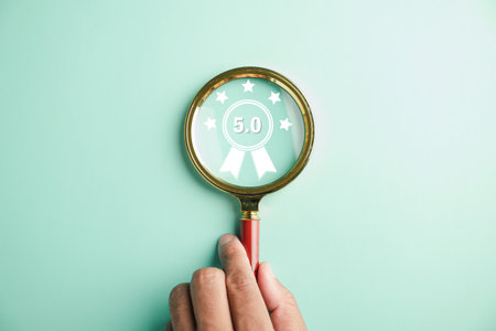 Magnifier in hand focuses on happy smiley face icon emotions. Good feedback rating and positive customer review. Experience, satisfaction survey, mental health. Certificate symbolizes satisfaction.の写真素材