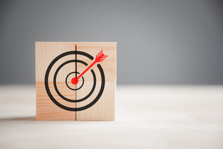 Action Plan, Goal, and Target icons on a wooden block step. Success and business target concept. Company strategy and project management symbolize achievement.の写真素材