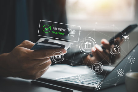 Man holding smartphone and credit card, shopping online. Happy female customer making a purchase in...