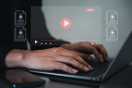 Person watching online tutorials on laptop screen, live streaming internet media player. Online education concept. Learning from digital content is a smart investment. OTT conceptの写真素材