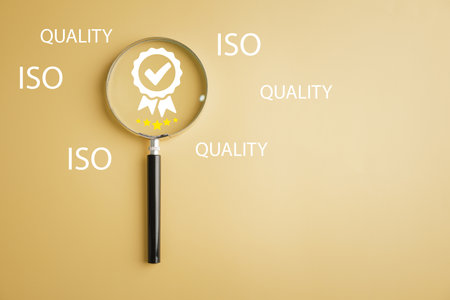 Magnifying glass with five-star and quality warranty icon represents quality assurance, ISO certification, and standardization concept. Symbolizing excellence and customer satisfaction.の写真素材
