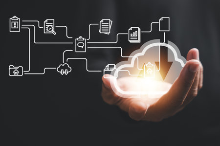 Hand of a businessman confidently holds the cloud computing icon, symbolizing the transformative...