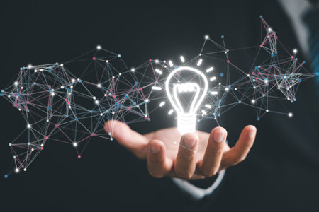 Innovative concept illustrated by person holding a light bulb. creative thinking process and generation of new ideas. bright solutions and energy bring to businesses and technological advancements.の写真素材