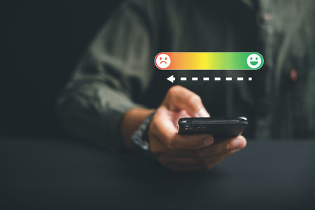 Negative feedback concept. Unhappy client rates 1 star using a smartphone on social media. Impact on business reputation and customer evaluation.の写真素材