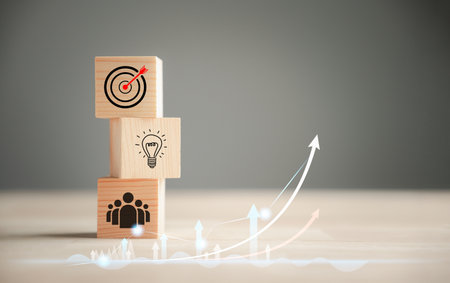 Business target concept on wooden block step. Action Plan and Goal icons symbolize success. Company strategy and project management on a table. Professional background.の写真素材