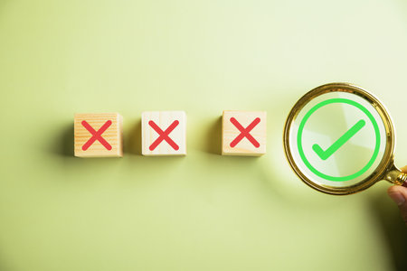 Using a magnifying glass and check mark icon, the image portrays the process of checking the...