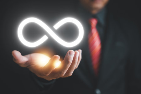 Circular infinity symbol on dark background, symbolizing circular economy and infinite possibilities. Strategy of sustainable investment, banking, and financial growth. technology infinity dataの写真素材