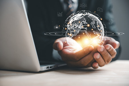 Innovative technology meets global network connections in grip of human hands holding Earth. This image signifies concepts of science, communication, and energy-saving. Background, Big data analyticsの写真素材