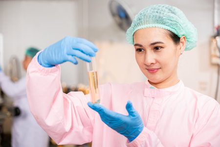 Within juice beverage factory woman food engineer illustrates food and beverage quality and safety...