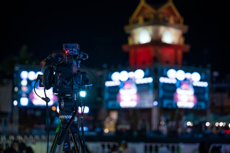 Professional video crew filming event on stage. Movie production expertise utilizing multimedia for...