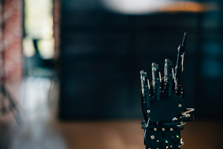 Black real robot hand illustrates futuristic design pressing on a table. Signifying artificial intelligence evolution and technological innovation in advanced robotics.の写真素材