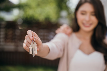 In real estate and moving a couples success is shown by keys carrying a mattress. Their happiness signifies the joy of a successful relocation. Moving Day Conceptの写真素材