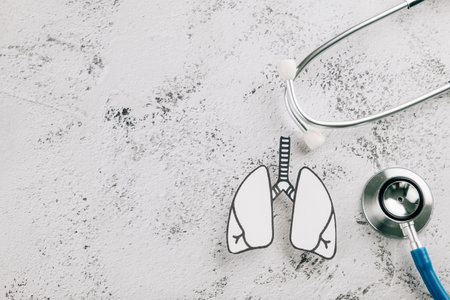 World TB Day design with lungs paper and stethoscope on textured gray. Focusing on lungs health, tuberculosis awareness, and healthcare for respiratory diseases.の写真素材