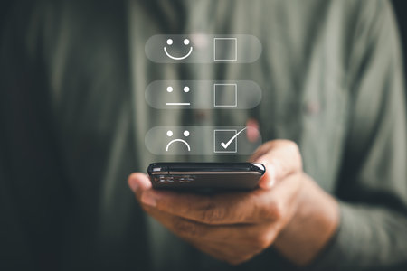 Unhappy client concept. Person holding smartphone showing one star rating. Expressing disappointment and sadness. Negative review, bad service, low satisfaction. dissatisfaction on business reputationの写真素材