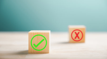 Wooden block featuring green check mark and red x. Conceptualizes choice and decision making. Think...