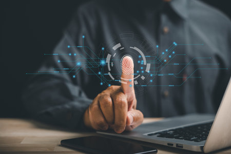 Securing your digital world with biometric identification and fingerprint scanning. Futuristic technology on screen providing access control and data privacy. Unlock future of information security.の写真素材