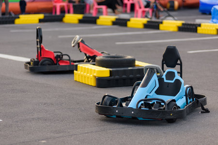Go-kart adrenaline rush. Powerful go kart machines wait at the starting line, ready to speed through an intense race.の写真素材