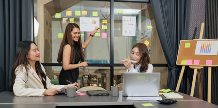 Business women meet, busy team people work on project, presenting data with colorful charts and...