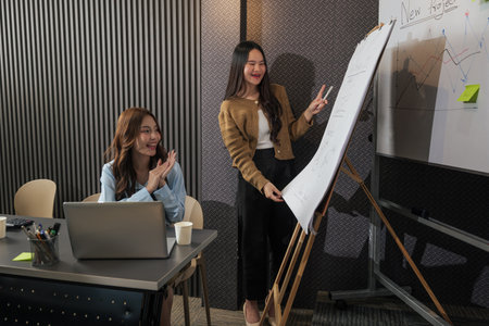Business woman presenting new project during team meeting, busy people collaborate work in...