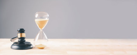 Hourglass legal law time, gavel for court justice, deadline, lawyer, judge, sand flowing,...