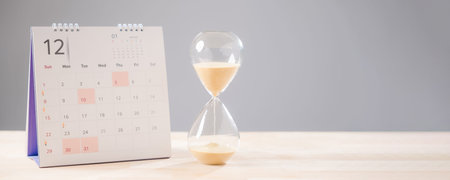Hourglass illustrates time passing, sand flows quickly, calendar shows important schedule, job...