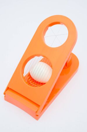 egg slicer on white backgroundの写真素材