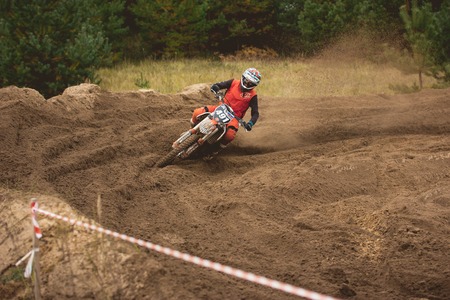 24 september 2016 - Volgsk, Russia, MX moto cross racing - dangerous maneuver motorcycle, telephotoのeditorial素材