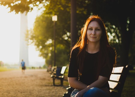 Young attractive woman in a park near washington monument, close upの写真素材