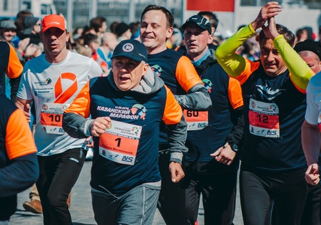 KAZAN, RUSSIA - MAY 15, 2016: Kazan Marathon 2016 - president of Republic Tatarstan Rustam Minnihanov runs with other runners, telephotoのeditorial素材