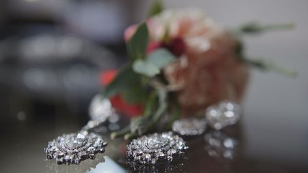 Wedding accessories on the table - silver earrings, close upの写真素材