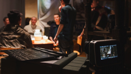 Film set - director, cinematographer and actors working on the cinema, wide angleの写真素材