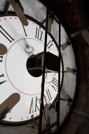 Clock face of old wall - mechanism inside, verticalの写真素材