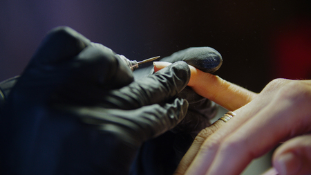 Close up view of professional manicure - nail master in beauty shopの写真素材