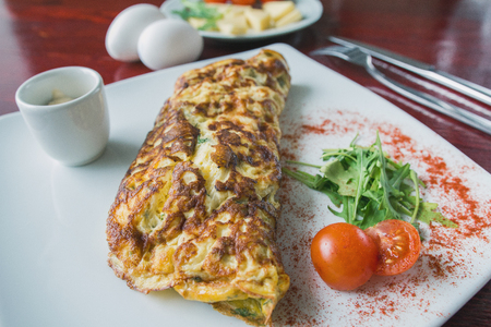 Breakfast - omelette with cherry tomato and greensの写真素材