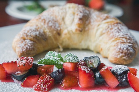 Dessert in restaraunt - croissant with fruit
